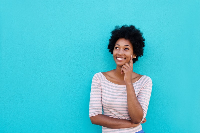 Woman thinking happily 